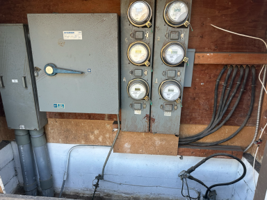 Existing meter bank before 400 amp multi-family electrical upgrade in Pasadena CA